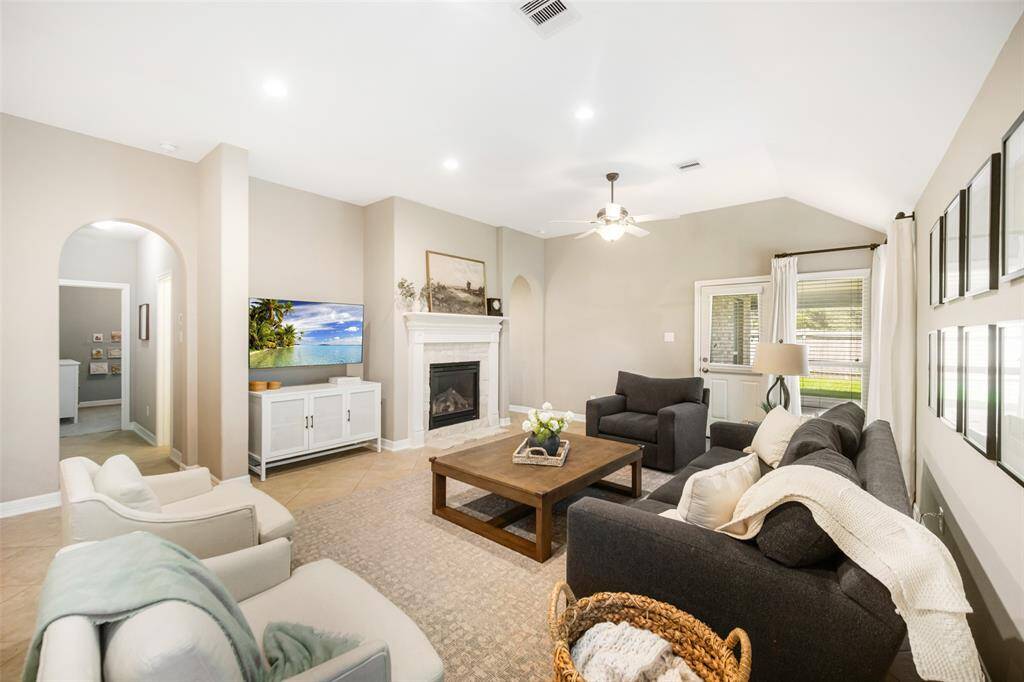 From every angle, this family room is both beautiful and practical.  The hallway at left leads to the two secondary bedrooms and bathroom.