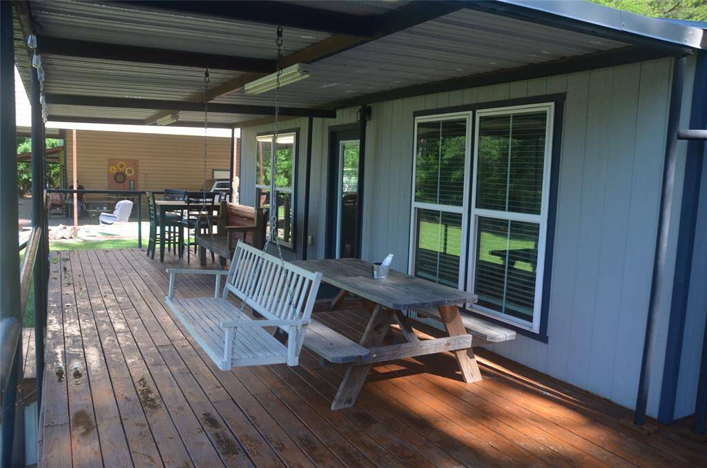 Sit Back on the Large Covered Front Porch (37'x12') and enjoy your front row view of the lake!