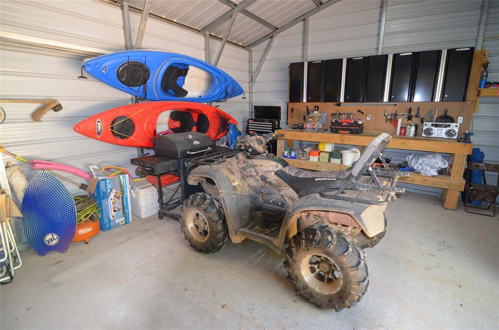 Garage view---Kayaks, 4 Wheeler included