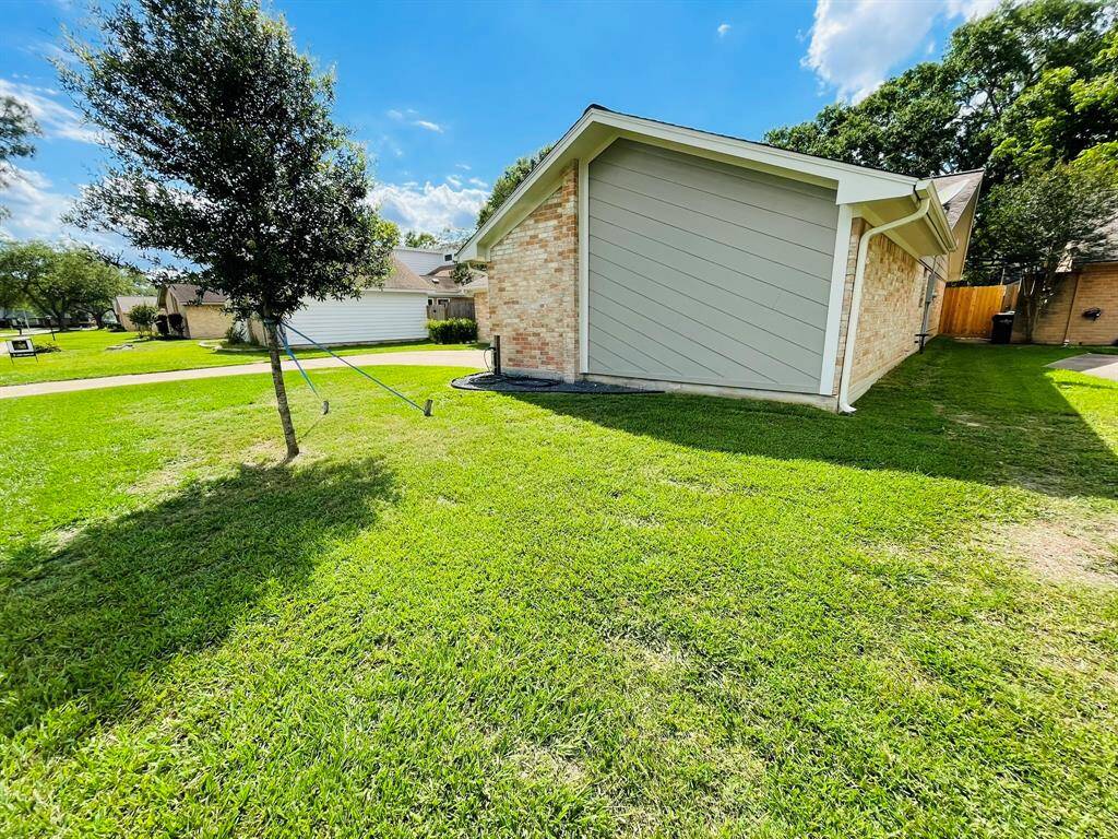 Front right of the house with brick and brand new cement board siding