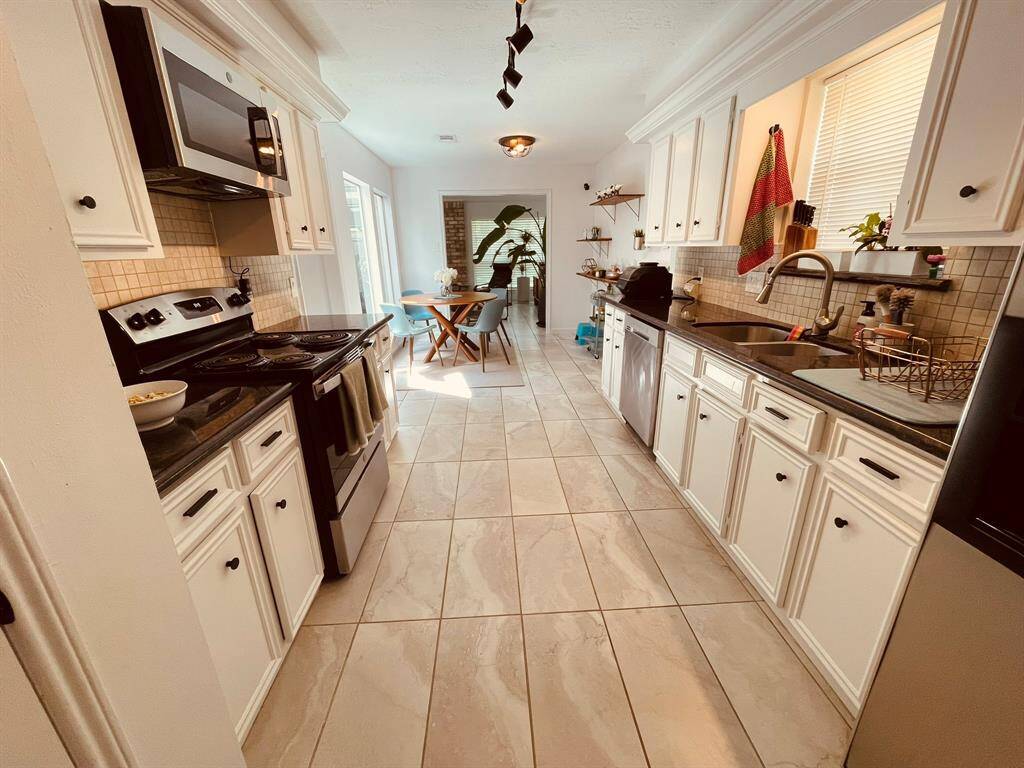 Kitchen with Stainless steel appliances and granite countertops