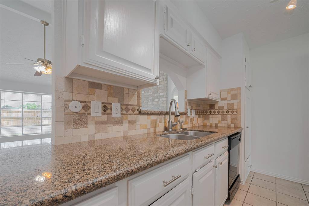 View of partial open kitchen to living room.