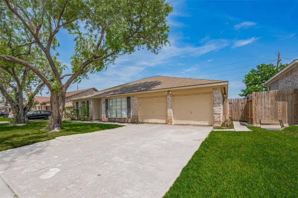 Two car garage and large driveway.