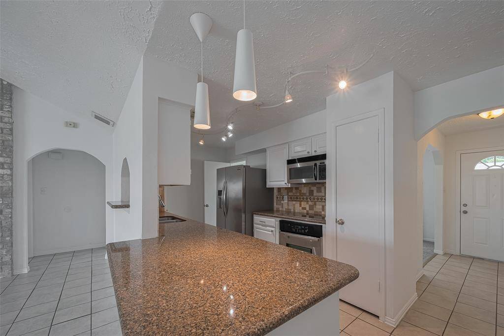 Kitchen boasts stainless appliance's and granite  countertops.