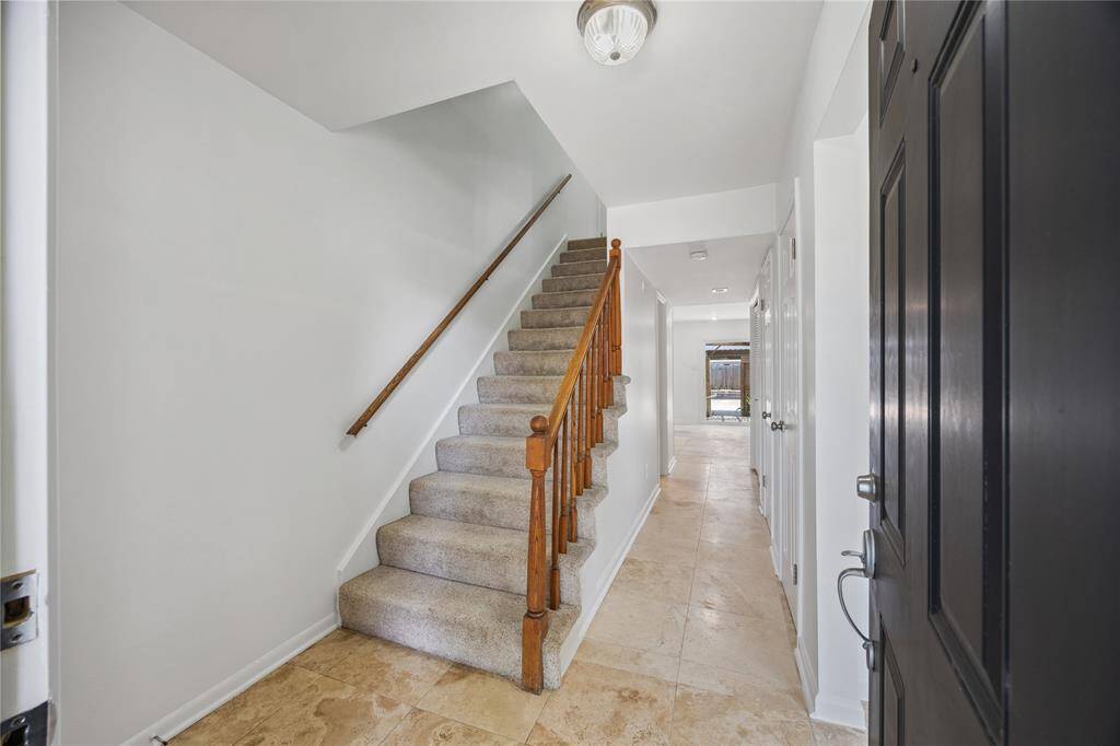 Welcoming foyer with a convenient coat closet, offering both charm and functionality right as you enter