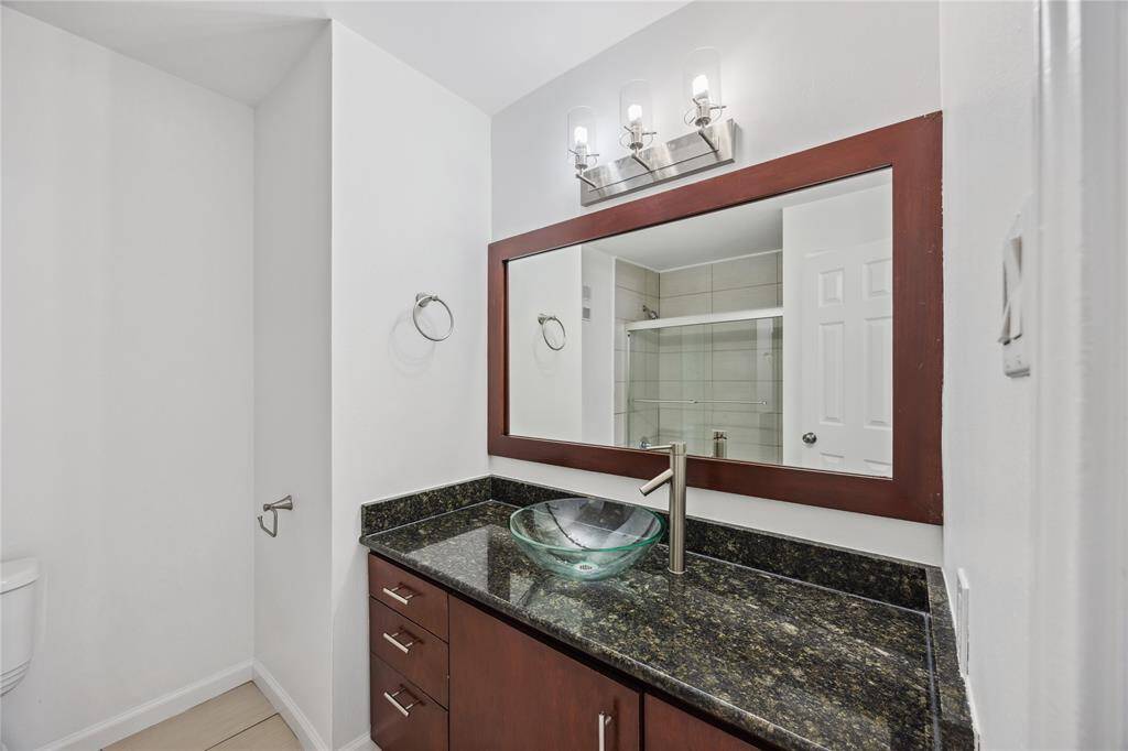 Versatile bath complete with a sleek shower/tub combo, designed for comfort and functionality