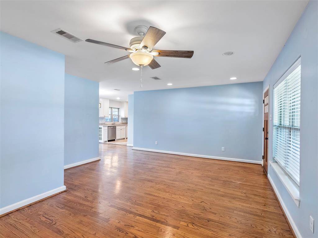 View from where you'll likely mount your tv. As you can see, thanks to the great flow of this house, you won't miss what happened while binging on The Last of Us when you run to the kitchen for another slice of mushroom pizza.