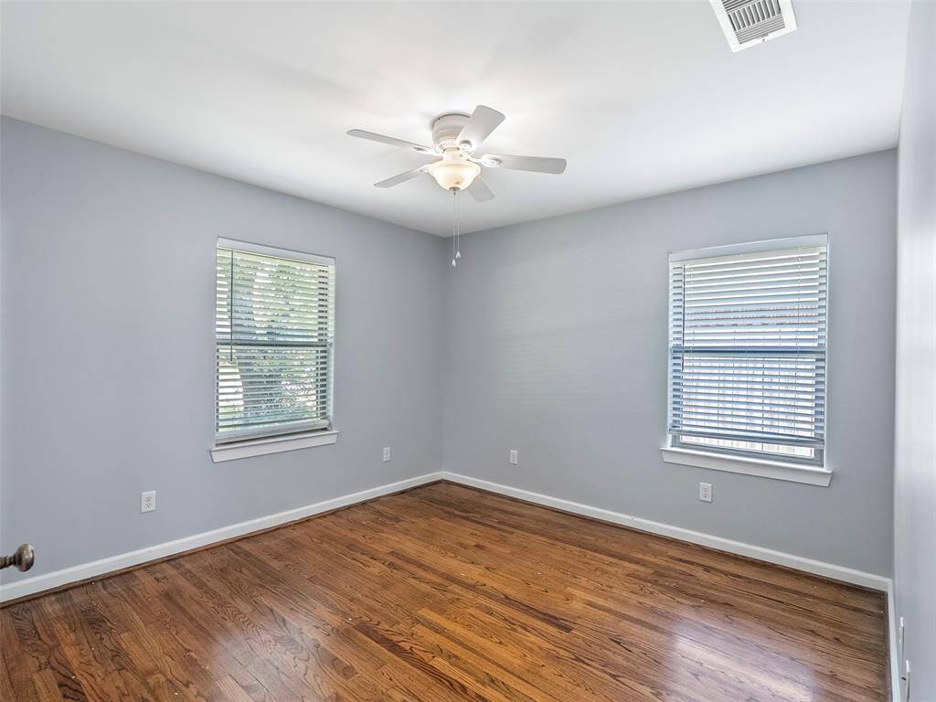 Second bedroom at the SE corner of the house has a peaceful view of the big ol' backyard.