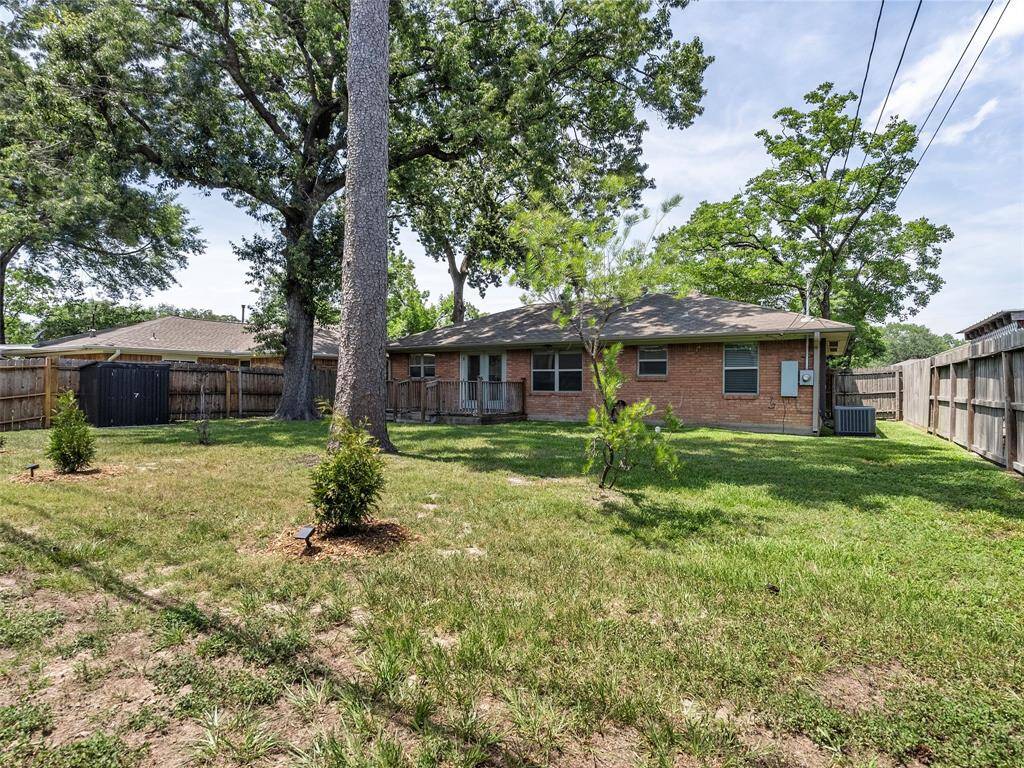 And here it is! Huge backyard with both mature trees and new additions to the landscaping. And just for you to enjoy, check out the brand spankin' new black storage shed along the west fence!