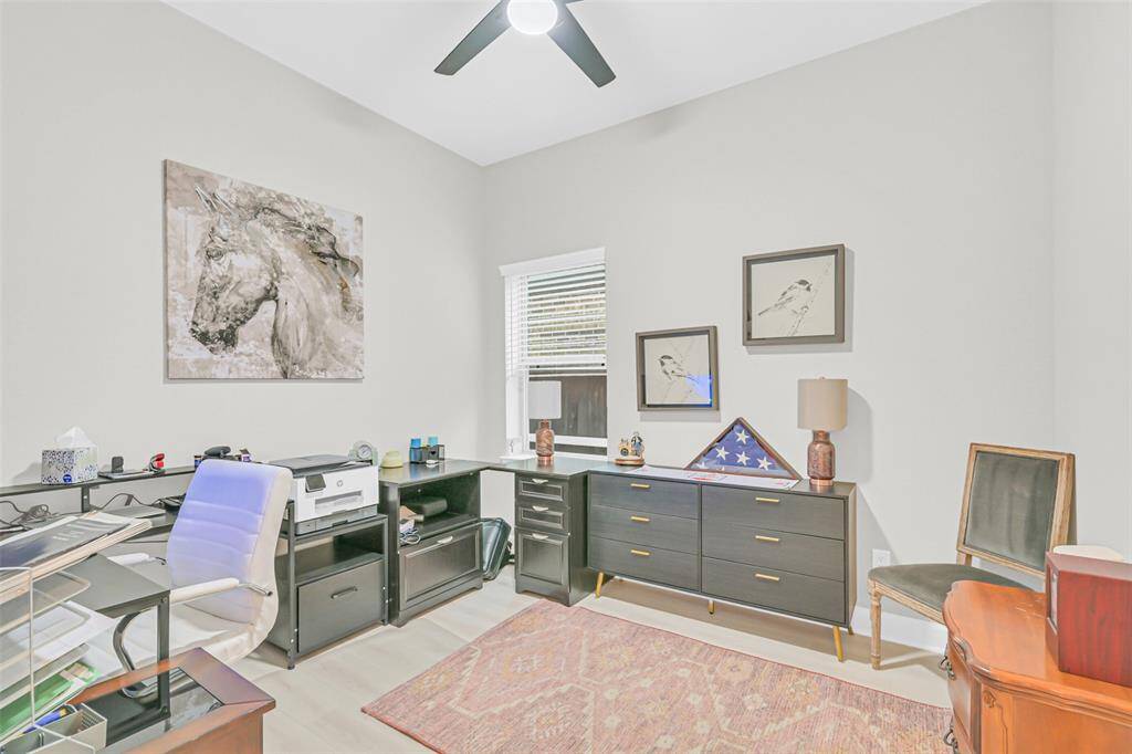 This versatile secondary bedroom is perfect for a home office, complete with an energy efficient ceiling fan and neutral tones to support focus and productivity.