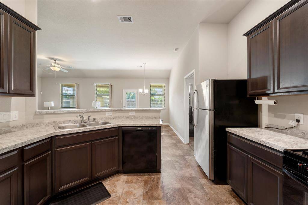 There is plenty of counterspace, and wooden cabinetry.