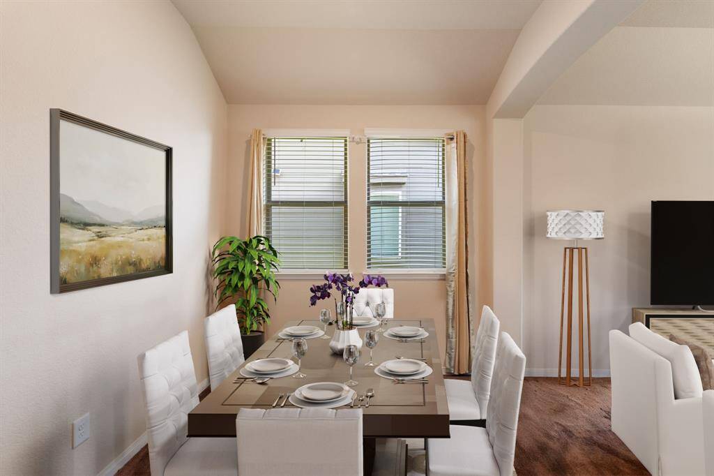 Virtually Staged: Dining area with tile floors, and windows with privacy blinds.