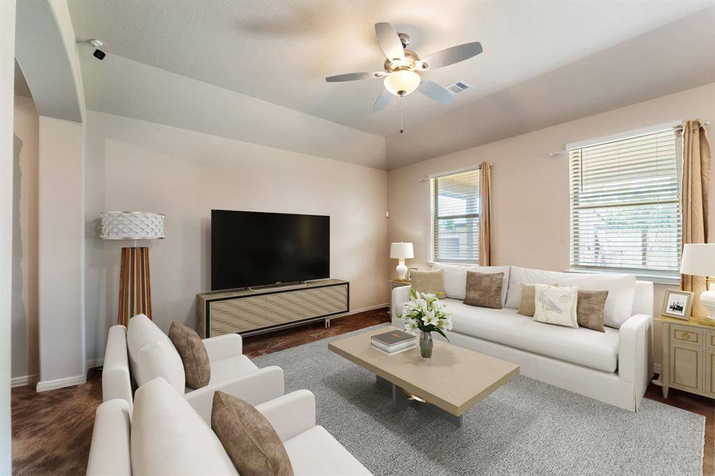 Virtually Staged: Bright and spacious living room with carpet floors, and a ceiling fan.
