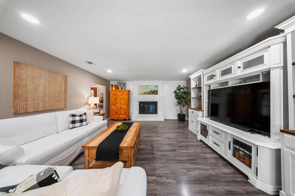 Charming additions throughout, including custom mud bench, sliding barn door, shiplap and wainscoting.