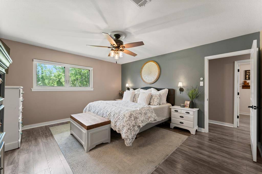 Charming sliding barn door provides privacy with style.