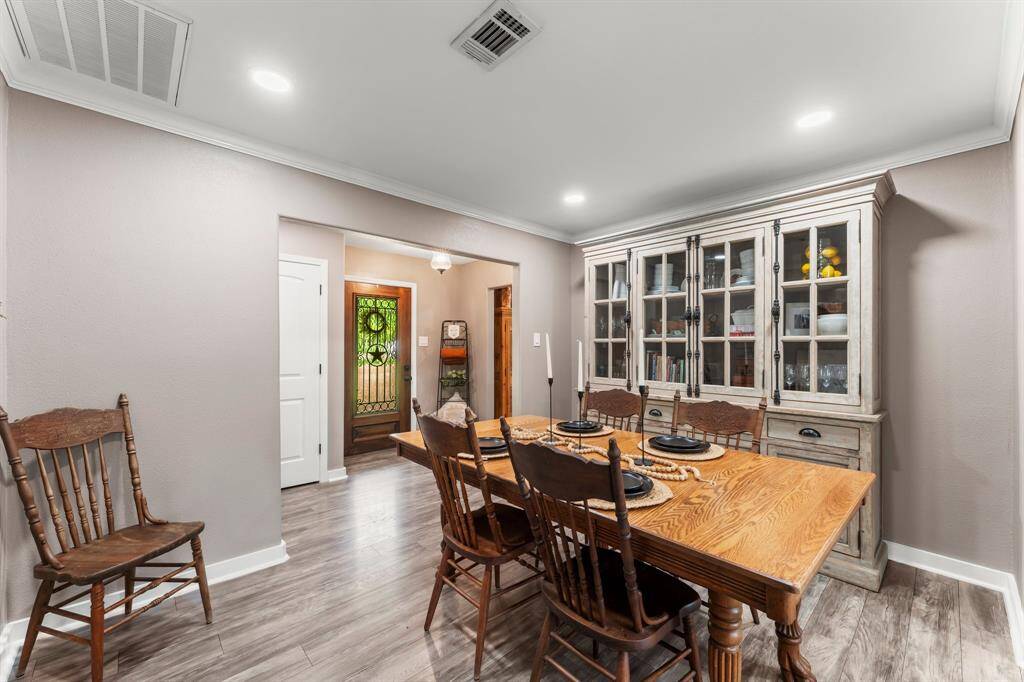 A cozy brick fireplace in the living room is perfect for chilly nights inside.