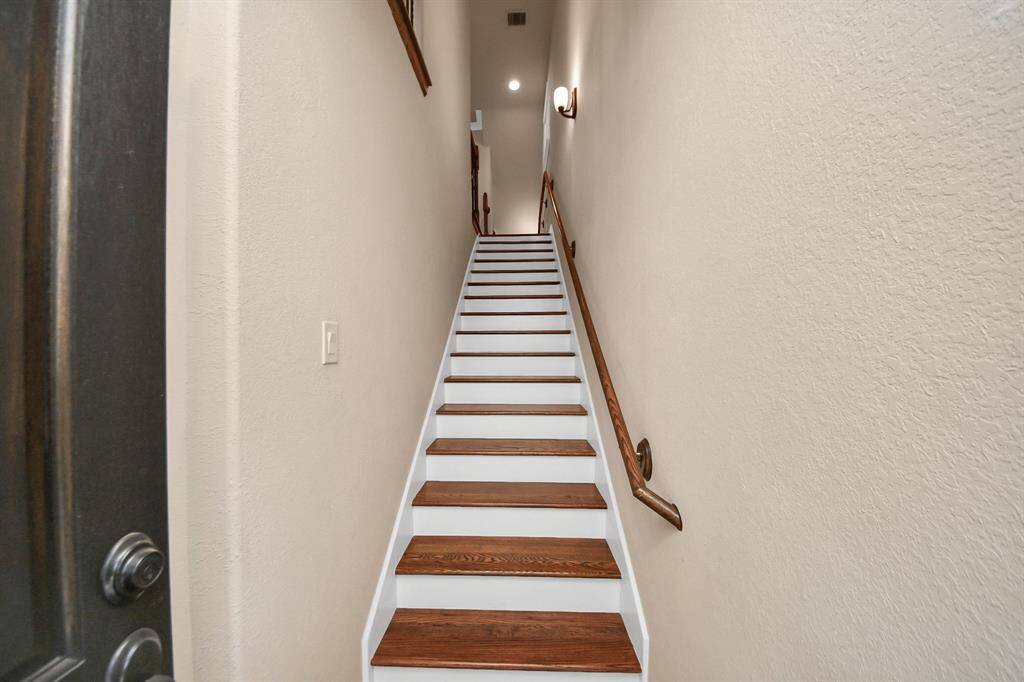 Entry stairs lead to the second floor with the kitchen and main living area.