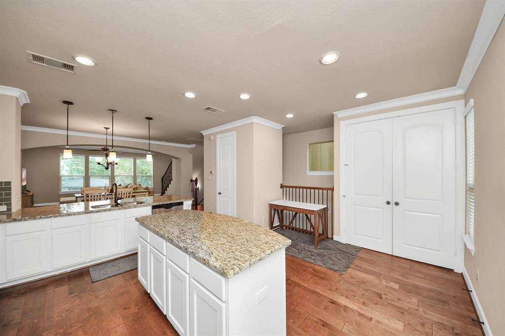 Kitchen Island includes built-in cabinets for extra storage.