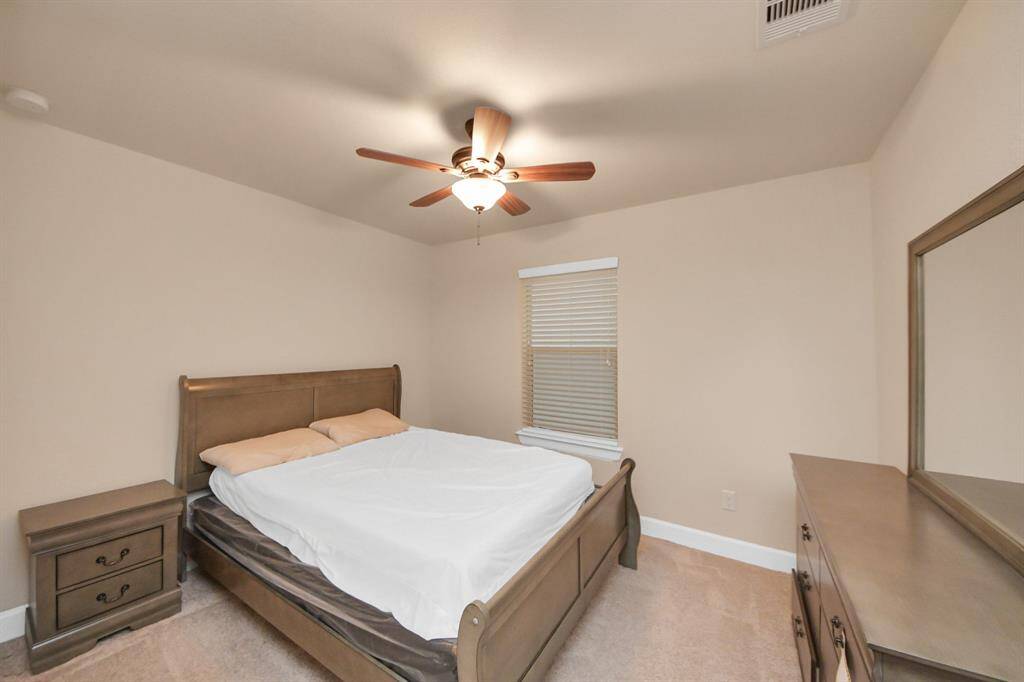 Bedroom with its own living room area and bathroom, located on the first floor for easy access.