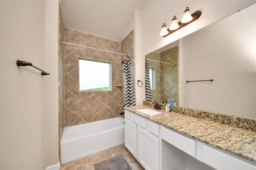 Bathroom on the first floor by the garage.