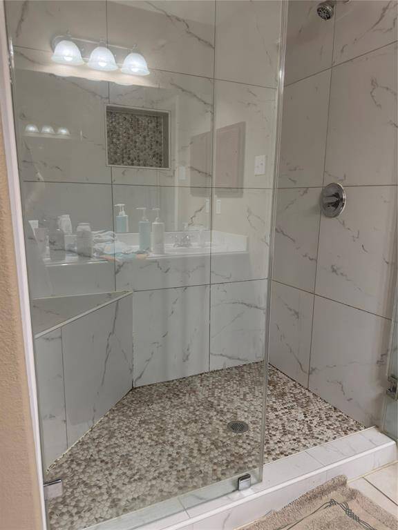 Walk-in shower in primary bedroom