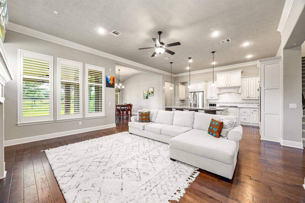 Designed for effortless entertaining, the open-concept layout seamlessly connects the living room to the kitchen and dining area, perfect for gatherings large or small.