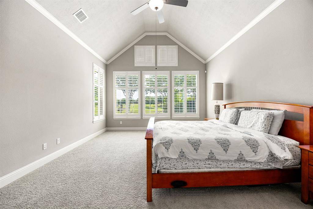Virtually staged photo of the primary bedroom to showcase the spacious layout, plenty of room for a king sized bed, seating area, storage and more!