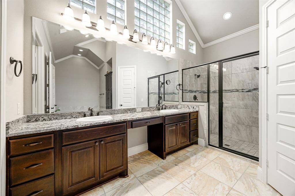 The luxurious primary ensuite features dual vanities, a soaking tub, oversized separate shower, and a spacious walk-in closet combining comfort and convenience in a spa-like setting. Don't miss the high ceilings