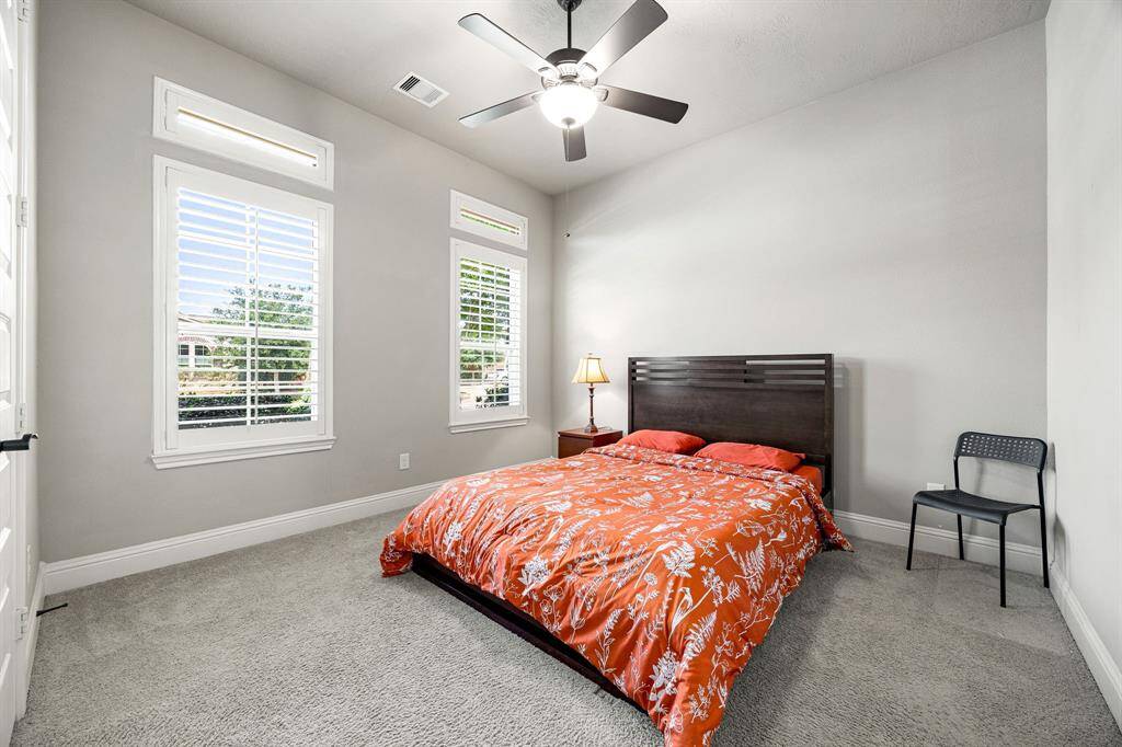 Conveniently located on the main floor, the secondary guest bedroom offers privacy and comfort ideal for guests or multigenerational living.