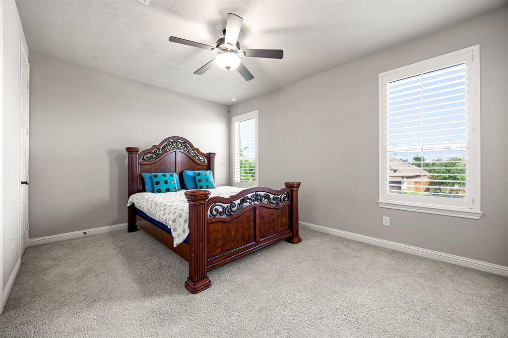 Virtually staged photo of the game room upstairs, ample space for lounging, gaming, or cozy movie nights with family and friends.