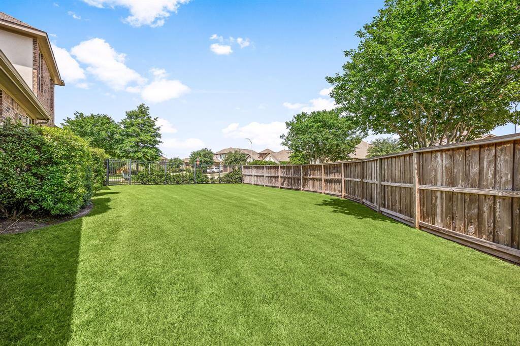 This oversized L-shaped covered patio offers plenty of space for outdoor dining, lounging, and entertaining, all with scenic water views and a backdrop of green space. With a walking trail just steps away, it’s the perfect setting to enjoy both relaxation and nature right from your backyard