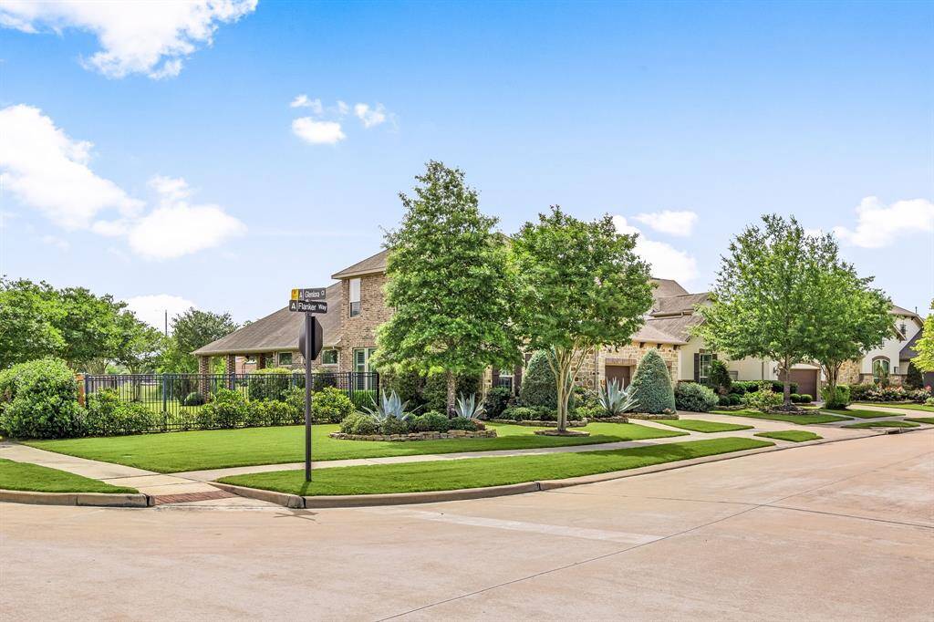 Prime corner lot with generous outdoor space and curb appeal.This home has beautiful water views and a walking trail behind the back fence.