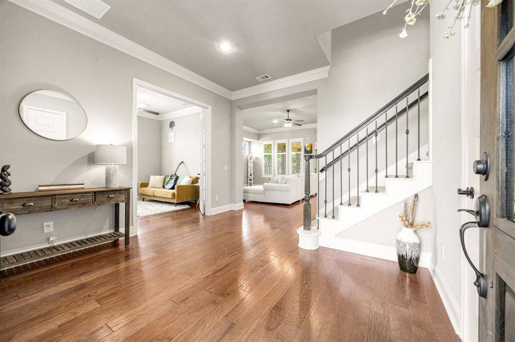 Step inside to a bright entryway with a clear view of the open living area and a private study, blending comfort and function from the moment you arrive.