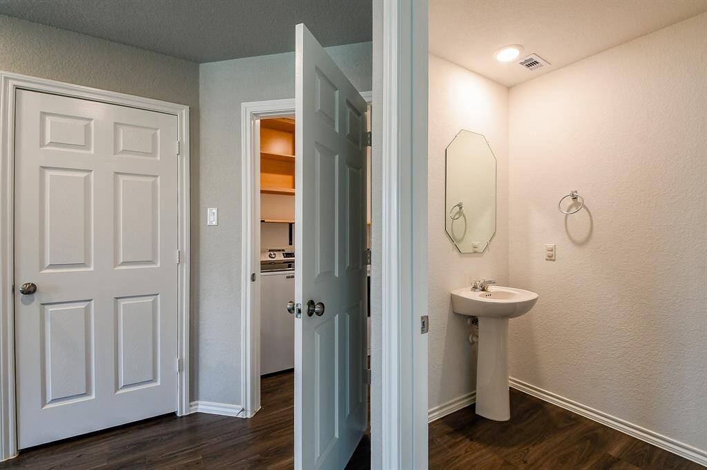Pantry on your left, open door is the laundry room and right next to it, the half bath for your guests.