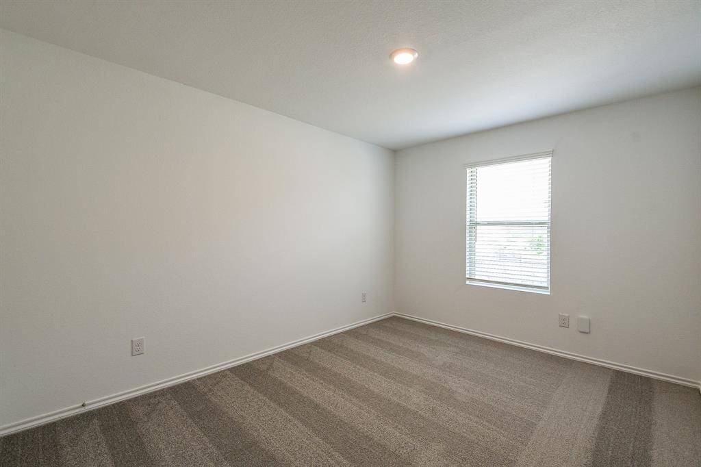 Another large bedroom facing the garden.  This home boasts beautifully designed large bedrooms,