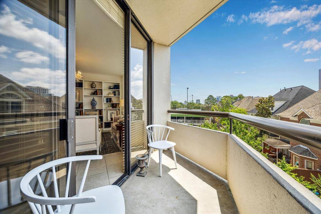 Primary bedroom with stunning city views and ample storage, featuring two walk-in closets plus an additional closet.