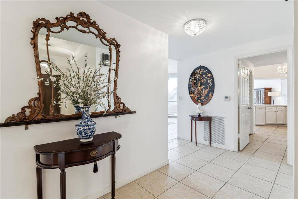 Primary access to balcony overlooking pool and tennis court.