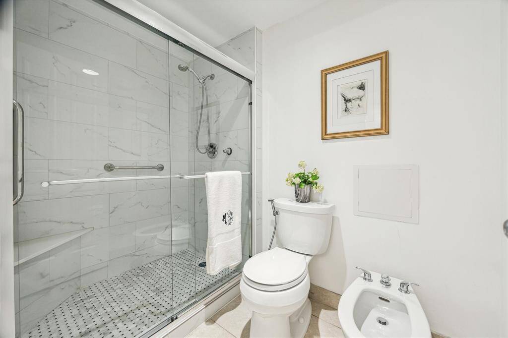 Bath 2 - extended vanity and separated shower and bath and linen closet.
