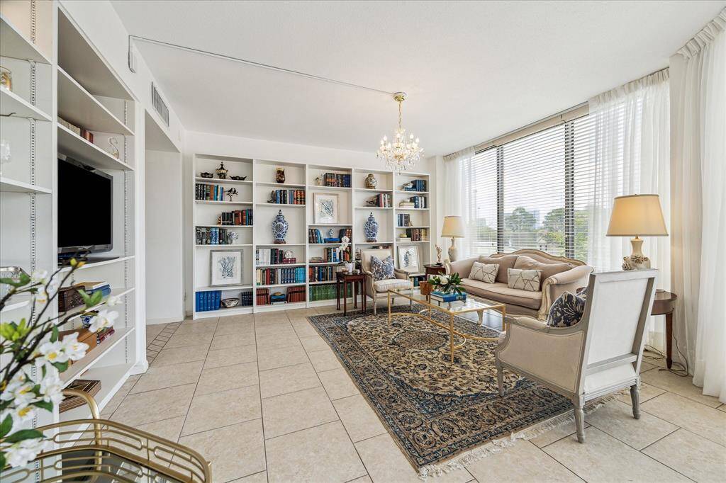Enjoy serene views from the balcony nestled between the living and dining rooms.