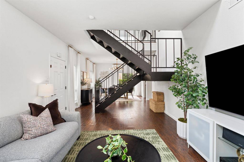 Large corner townhome features a side patio off of the dining room to grill or sit out and enjoy the outdoors.