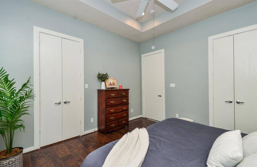 Private primary bedroom includes double doors leading into the primary ensuite bath. One of the primary walk-in closet spaces are in this room.