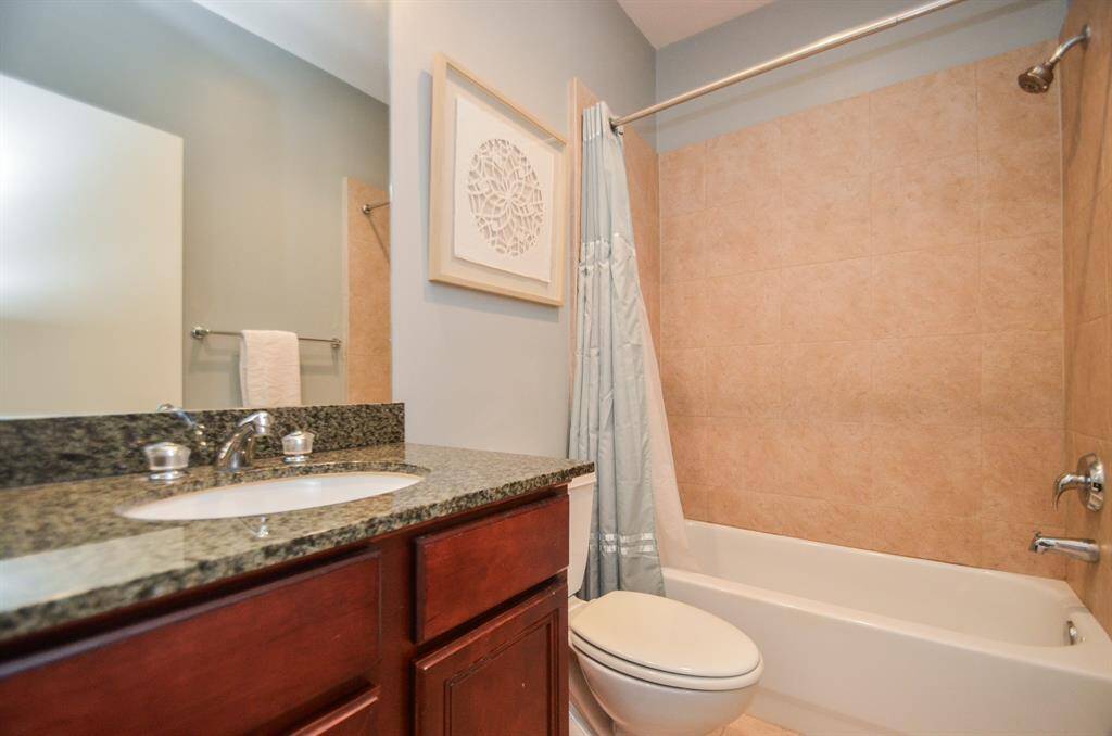Cozy room features hardwood floors, a ceiling fan, & ample natural light from a window/glass door. 2nd bedroom includes enough space for a daybed, a bookshelf, and a small desk. A perfect space for relaxation or work.