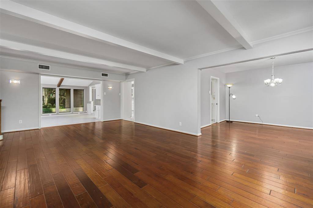 The view from the front entry toward the sun room (center) and the dining room to the right.