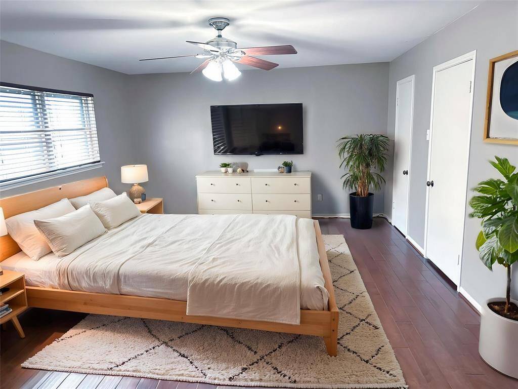 *Virtually Staged* Bedroom 1 - Spacious (19 x 14) downstairs primary. (Paint color is not accurate.)