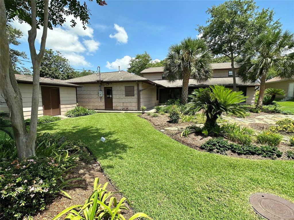The beautifully landscaped yard is zoned with programable automatic sprinklers.