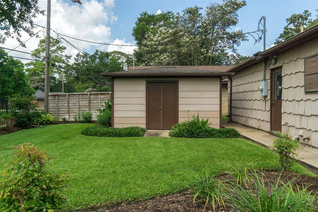 Shed is located just outside the pedestrian garage door
