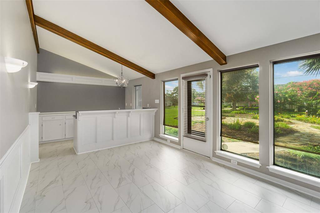 Back door leads to the yard or pull up a barstool at the wet bar and relax for a bit.