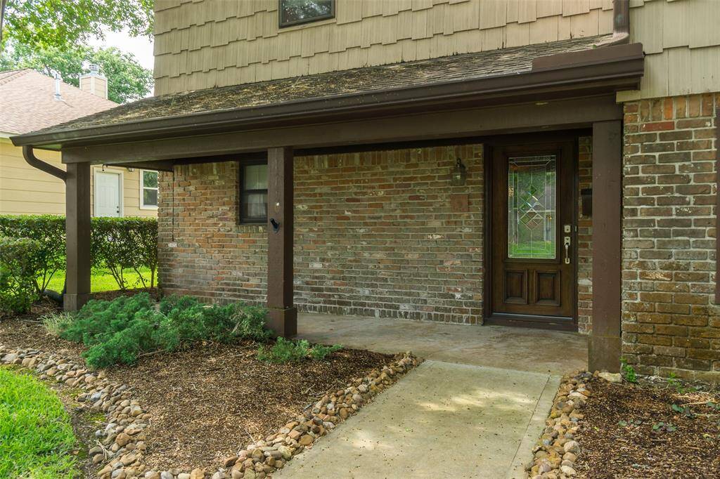 Lovely front porch, perfect for enjoying sunrise or sunset. To the left of the front door, find a roll down shade to ward off the morning sun.