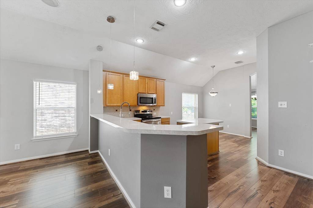 Room for stools to line up around the eat in breakfast bar.