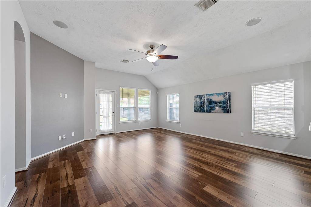 Light & bright living area off the kitchen is perfect for entertaining.